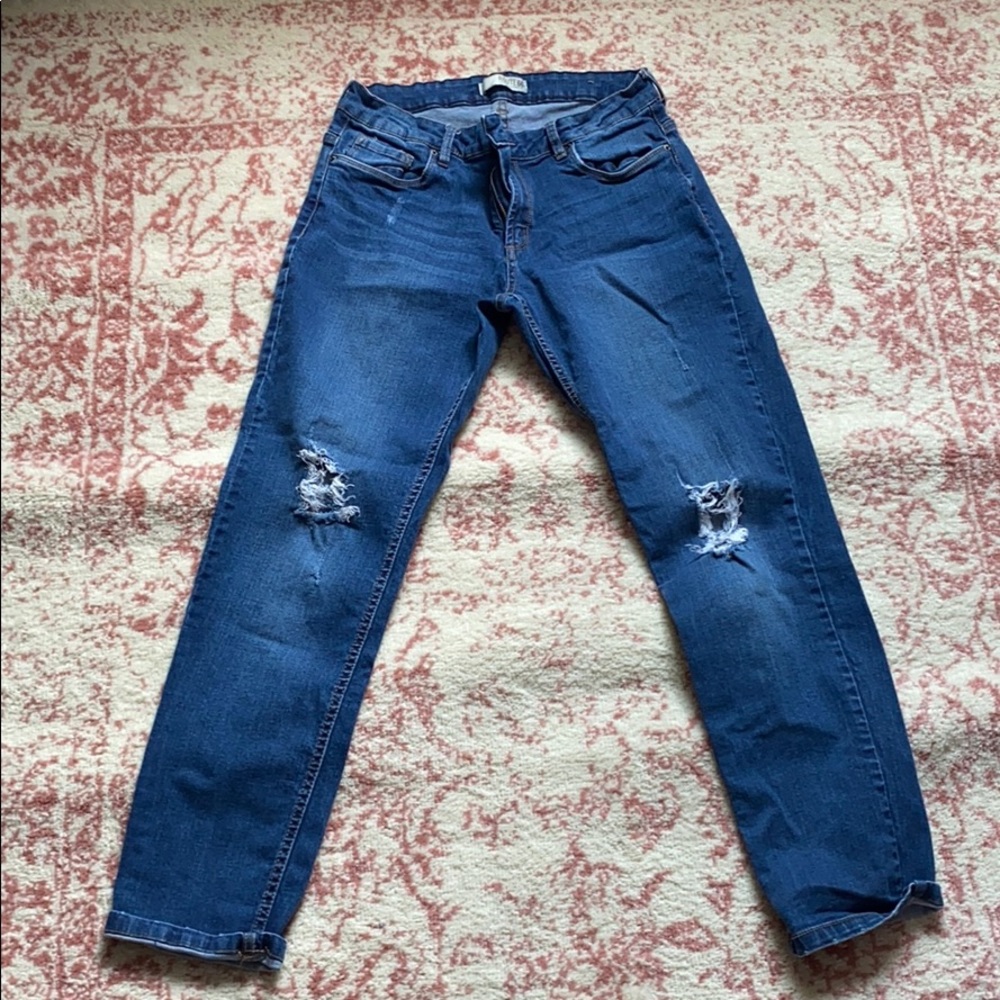 I am selling denim boyfriend fit ripped jeans.